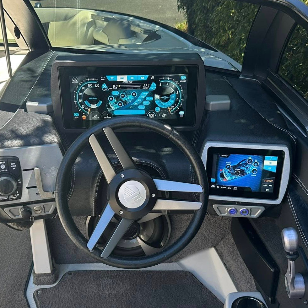 Boat interior with dashboard, steering wheel, and control panels.